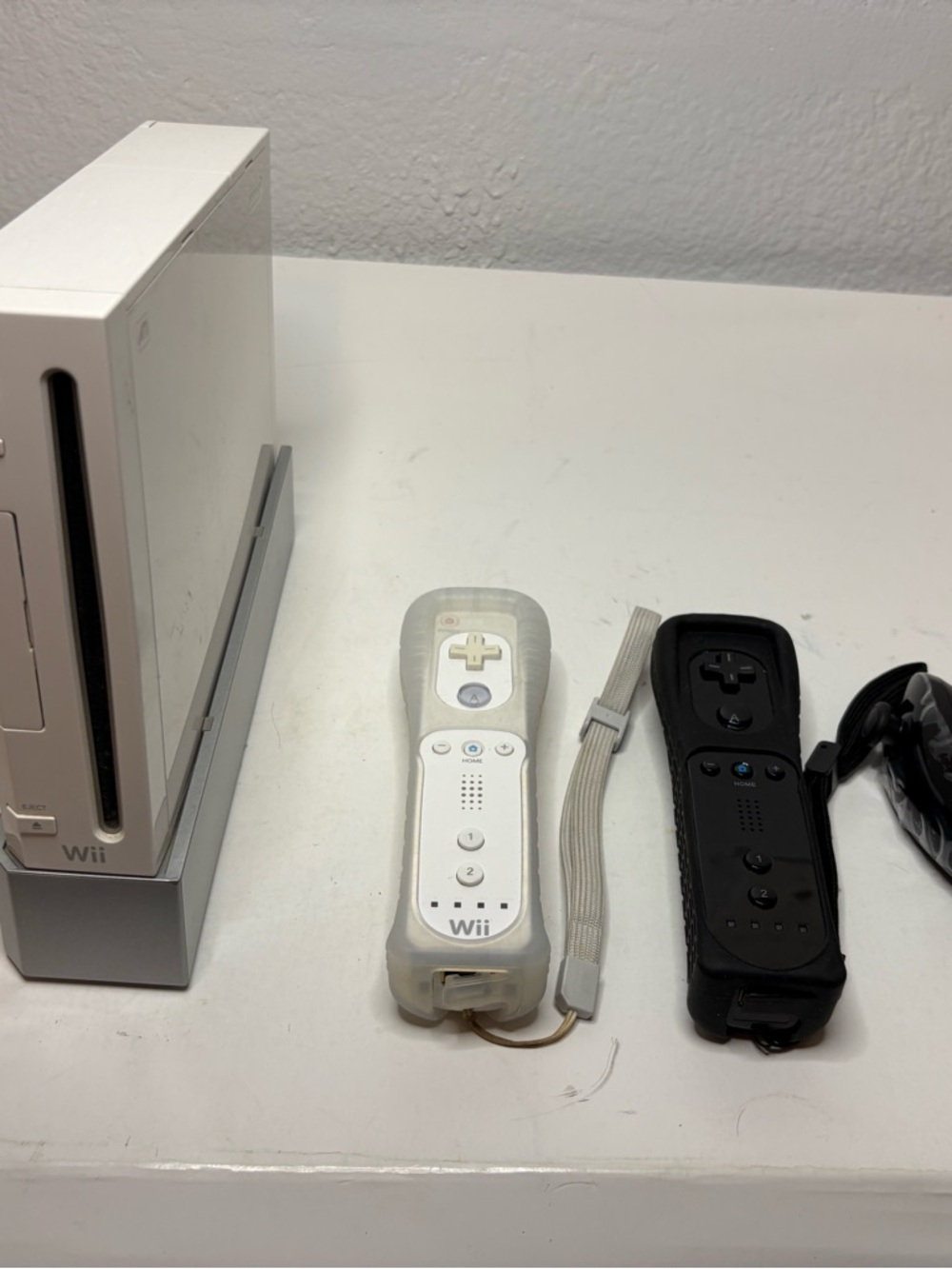 Nintendo Wii Console with White and Black Remotes